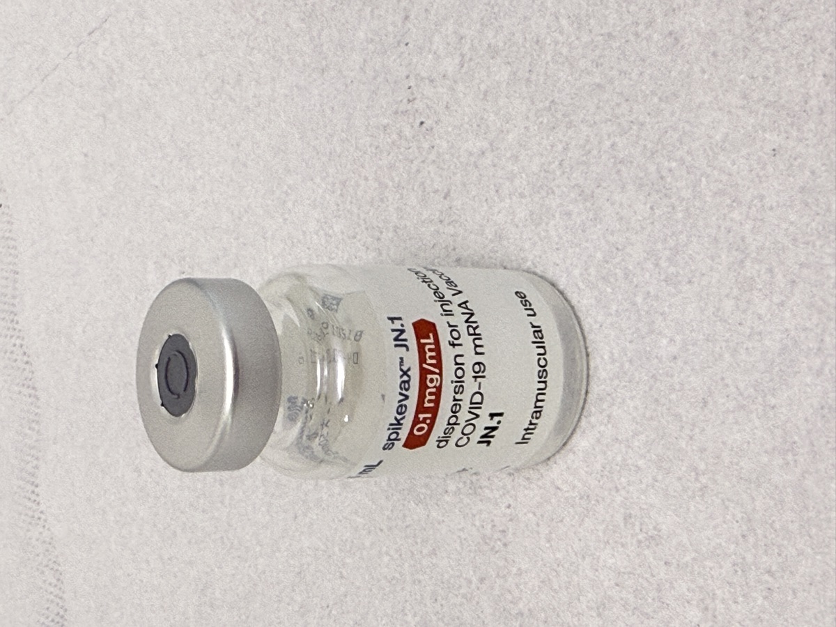 A vaccine vial - a representative image for a 2026 first-in-human trial of pEVAC-PS, an AI-designed universal coronavirus vaccine (the actual vaccine is a needle-free DNA vaccine)