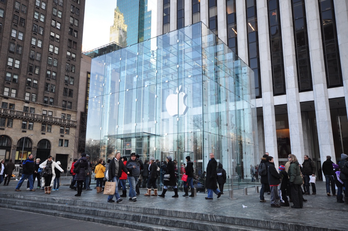 The glass cube entrance of Apple's Fifth Avenue store in New York, illustrating Apple's App Store ecosystem reaching $1.4 trillion in billings and sales in 2025
