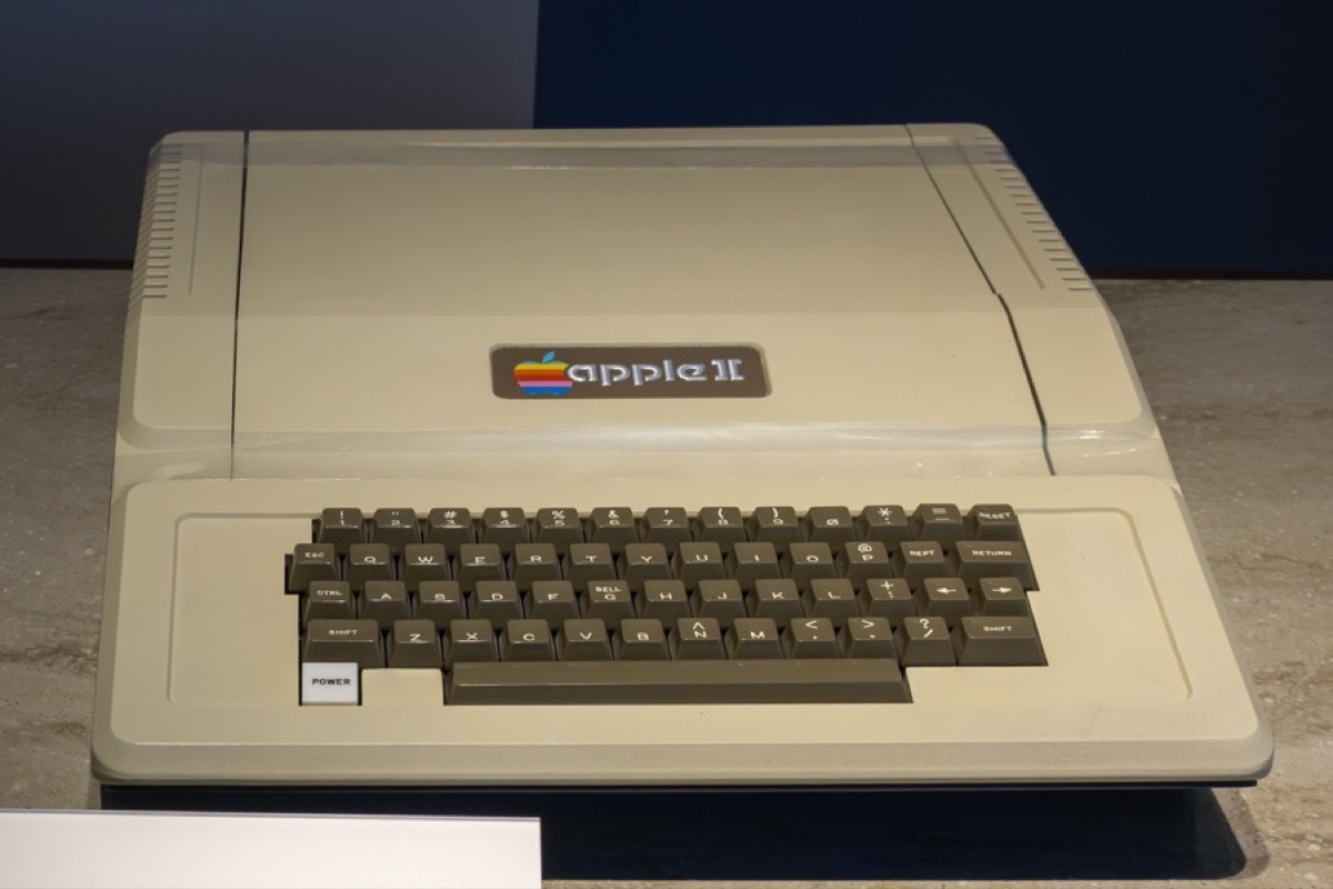 Apple II computer at the Computer History Museum showing the iconic beige case with rainbow Apple logo and built-in keyboard