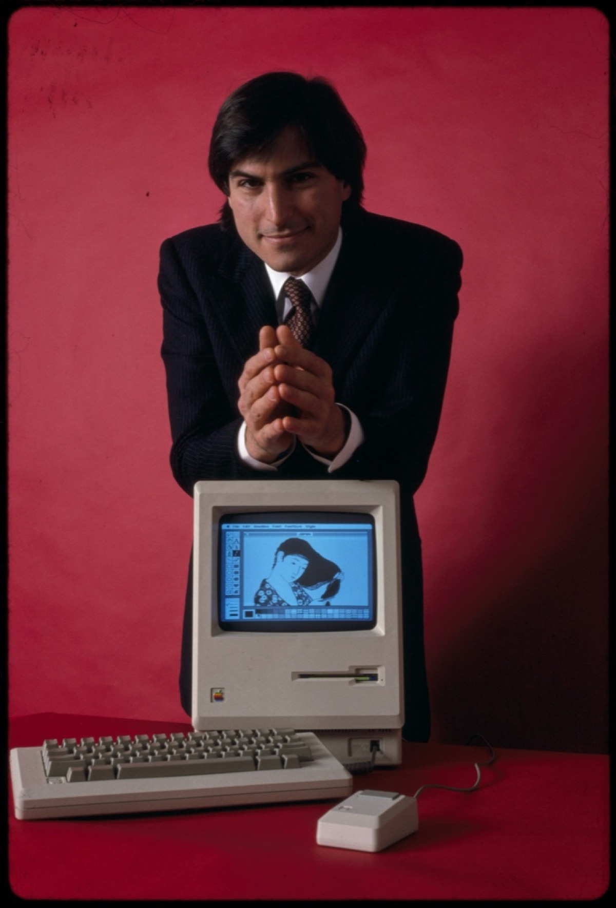 Steve Jobs holding the original Macintosh 128K computer in January 1984, photographed by Bernard Gotfryd from the Library of Congress collection