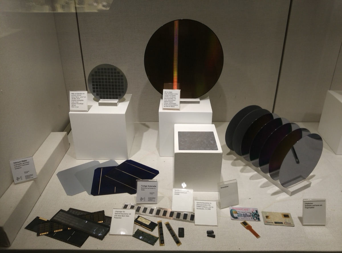 A tray of polished silicon wafers - the discs from which computer chips are cut - representing the custom silicon at the heart of Apple and Broadcom's chip partnership, now extended through 2031