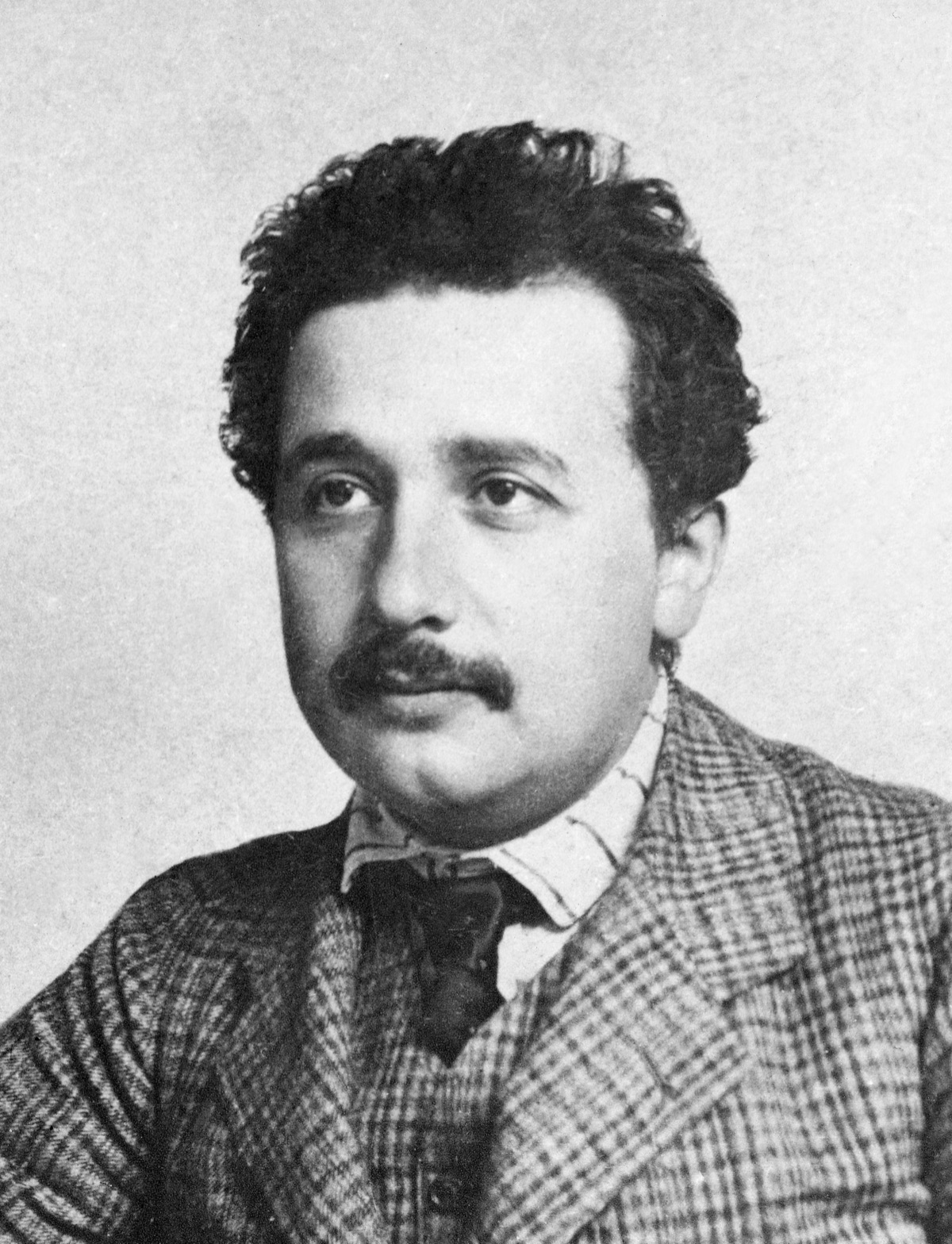 A photograph of a young Albert Einstein around 1905 - his Annus Mirabilis, or miracle year - taken while he worked as a clerk at the Swiss Patent Office in Bern. Photograph attributed to Lucien Chavan; public domain (ETH-Bibliothek Zurich, Bildarchiv / Wikimedia Commons).