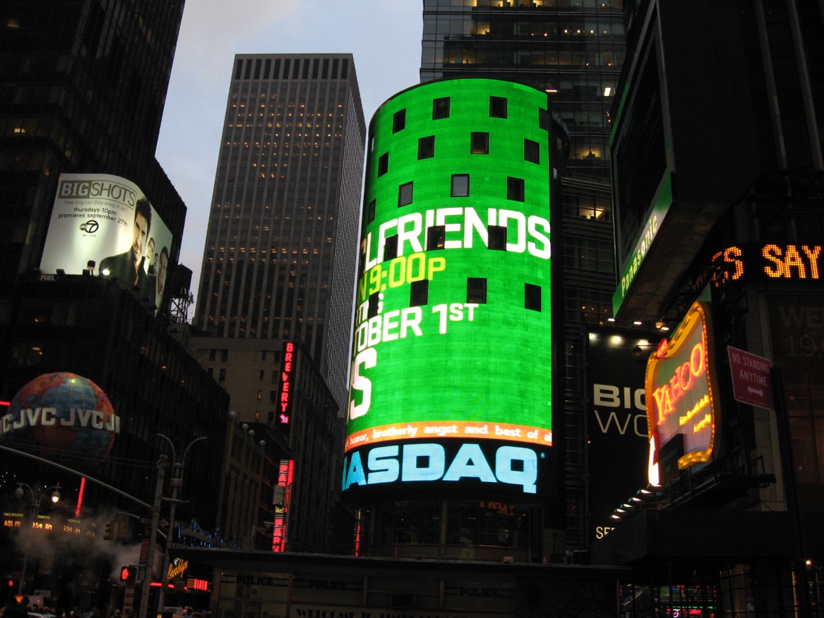 The Nasdaq MarketSite tower in Times Square, New York - a representative image of the public markets and the startup-investment world; the record SpaceX IPO that anchored 2026's exit wave listed on Nasdaq
