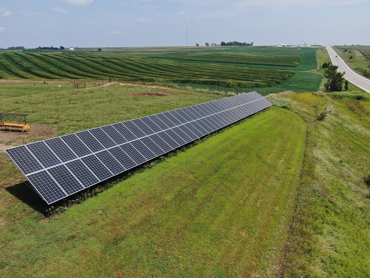 Aerial view of a large photovoltaic solar panel array on farmland, illustrating solar power becoming the European Union's single largest source of electricity in June 2026 (representative image, not a specific EU solar farm)