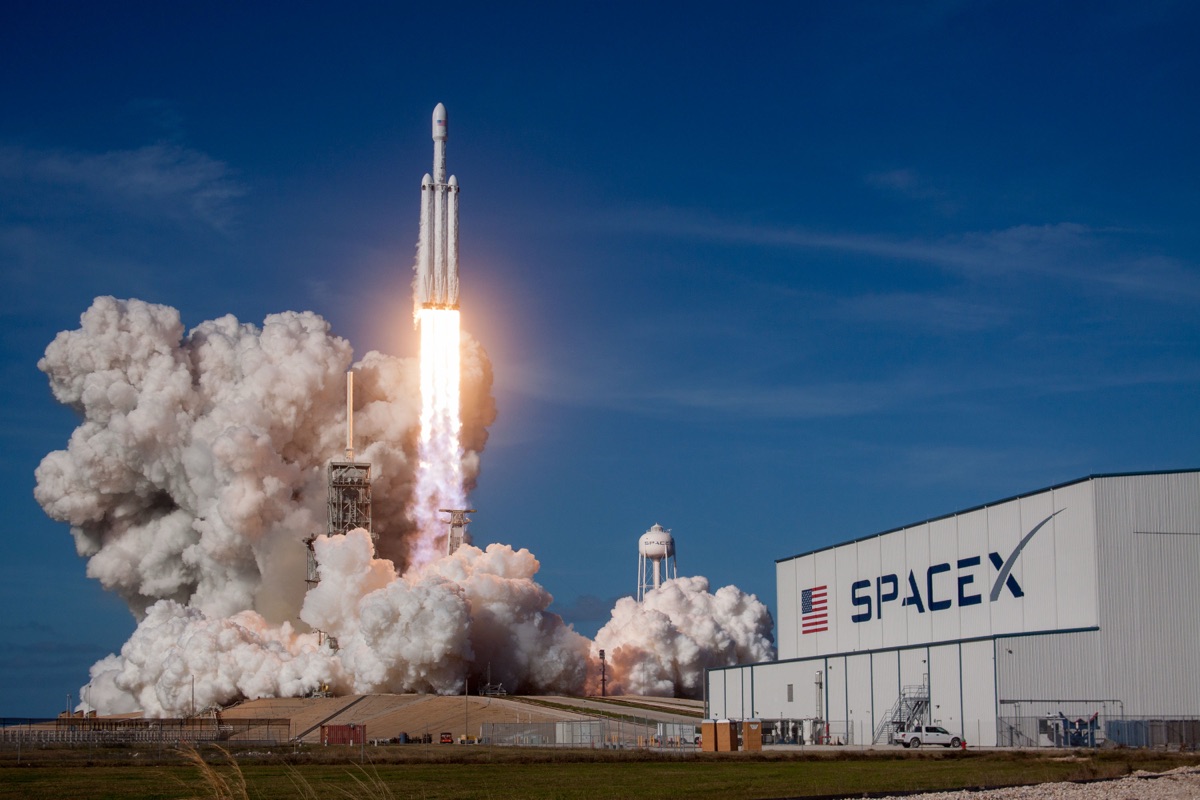 A SpaceX Falcon Heavy rocket lifting off, illustrating SpaceX's record-breaking June 2026 Nasdaq IPO under ticker SPCX