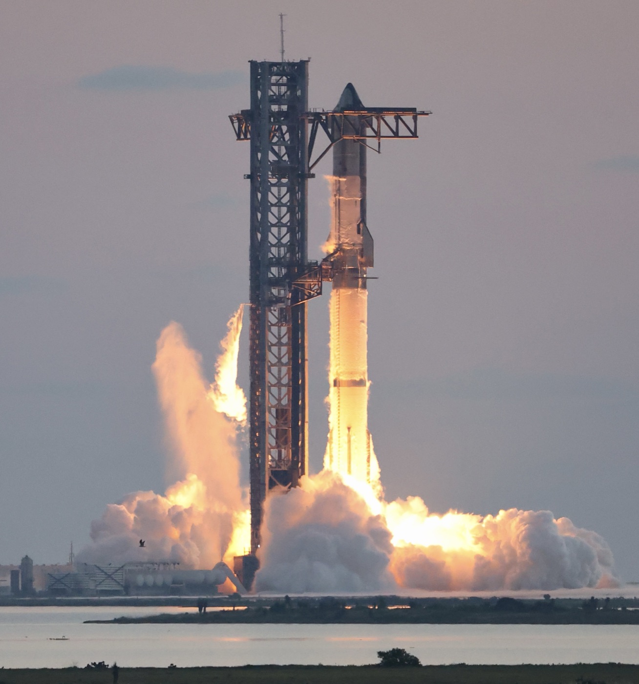 SpaceX Starship rocket ignition during the IFT-5 (Integrated Flight Test 5) launch, the heavy-lift vehicle that will deploy orbital data centers