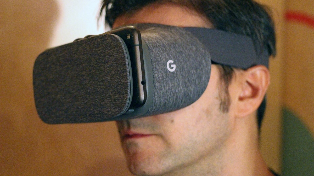 A person wearing a virtual-reality headset - a representative image of the immersive VR used in the study, in which volunteers saw themselves with feathered wings and learned to fly. The researchers used a custom VR flight setup with motion tracking, not this particular consumer headset.
